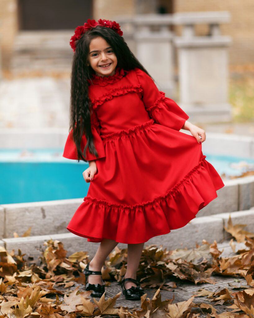 Cute baby in red dress