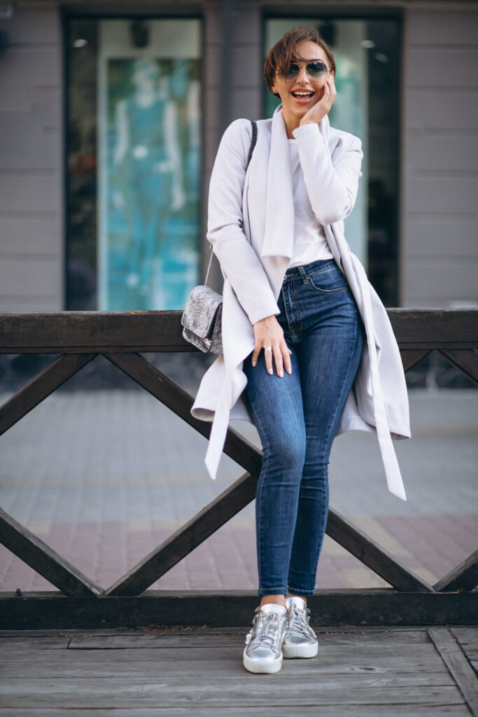 Women In Modern Jeans With Top