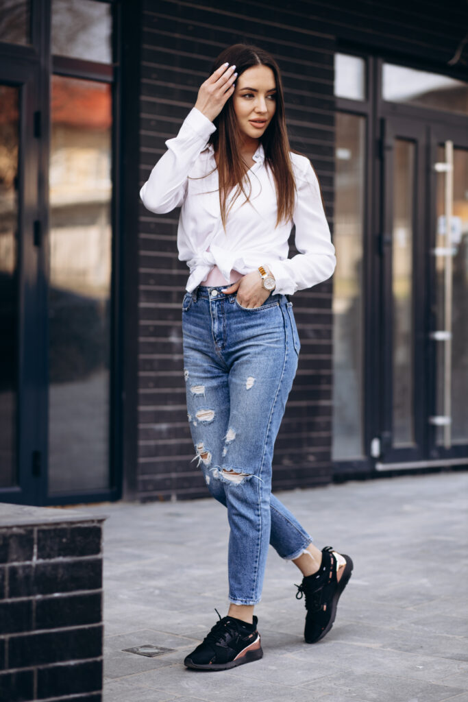 Women In Modern Jeans With Top